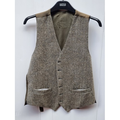 251 - A selection of six exquisite Irish made waist coats in tweed, herringbone and woven wool including a... 