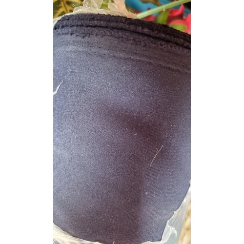 282 - A very large bolt of navy blue fabric.