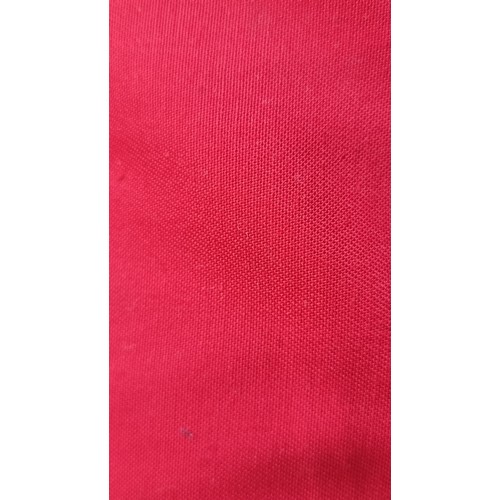 284 - A very large bolt of bright red fabric in a plain finish.