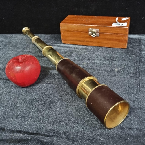 149 - A charming, three-draw telescope with a custom made wooden protective box.