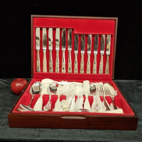 185 - A large hardwood cutlery canteen containing a mixture of EPNS and stainless steel cutlery. Including... 