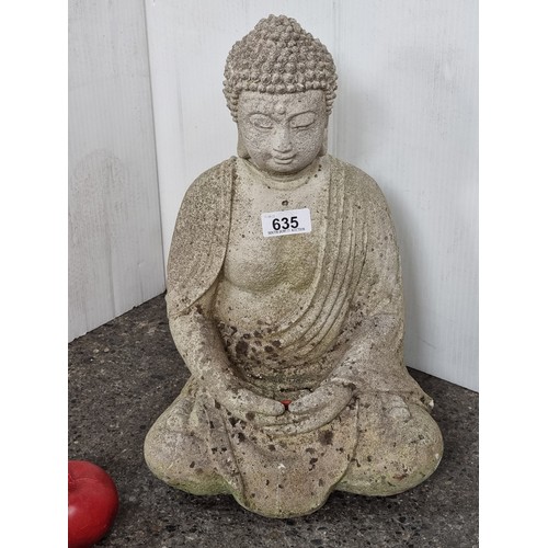 635 - A very heavy reconstituted stone garden ornament of a serene Buddha in a meditative pose.