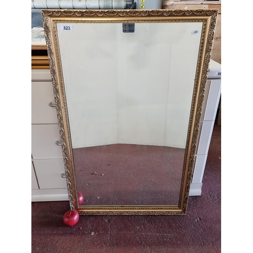 623 - A large rectangular wall mirror set into an ornate Baroque style frame.