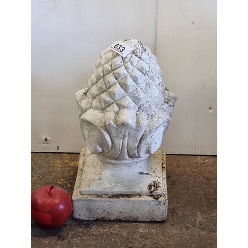 633 - A very heavy reconstituted stone garden ornament of a large acorn, with a white finish.