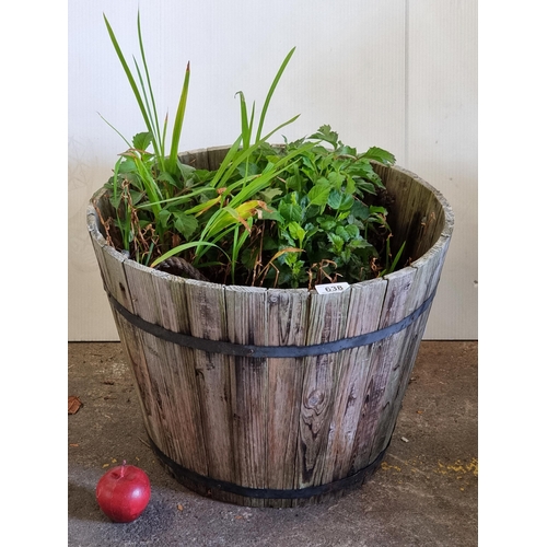 638 - A lovely large outdoor planter in the form of a barrel.