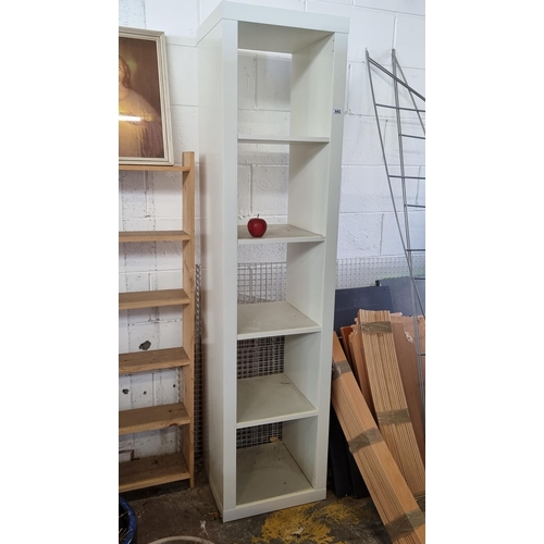 642 - A five tier, heavy white shelving unit. An ideal storage solution for narrow spaces. H185cm.