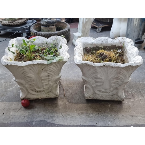 753 - A pair of huge reconstituted stone planters with lovely curved edges and high relief carving to base... 