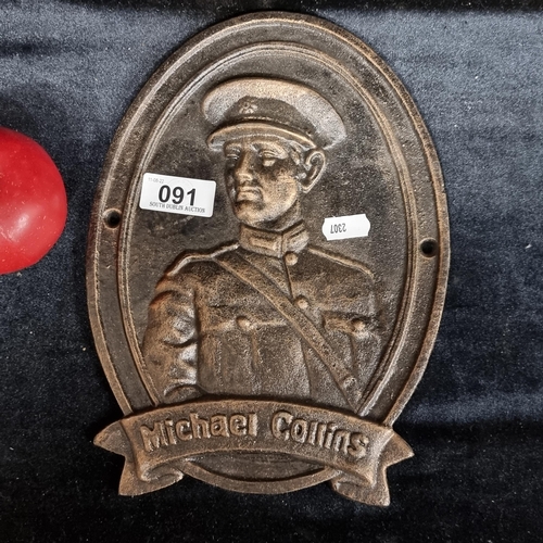 91 - A heavy cast metal wall mountable plaque commemorating Michael Collins.