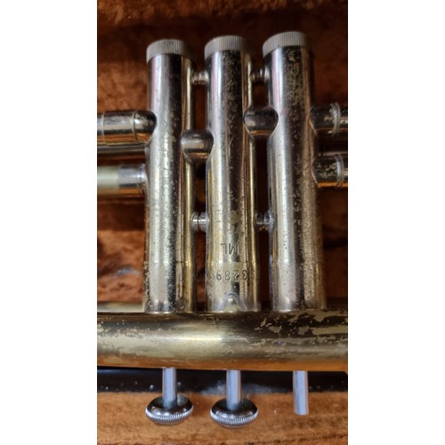 119 - A brass Rosehill trumpet (Model Number 932896) with an ML bore, accompanied by a Vincent Bach Corp 7... 