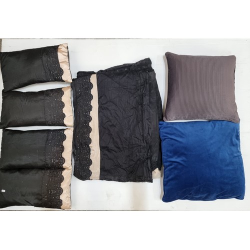 758 - A large bag filled with four small scatter cushions in blacks and cream with a matching duvet. With ... 