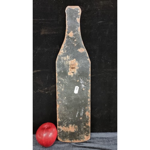 173 - A heavy, large enamelled advertising sign for Castillon Brandy, in the form of a bottle. A wonderful... 