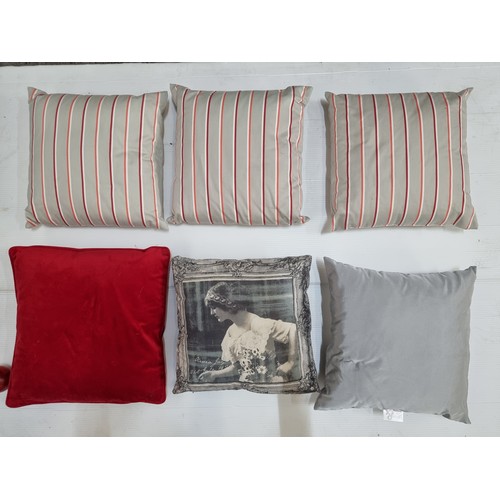 763 - A good selection of home decorations, including three matching striped cushions in red and grey and ... 