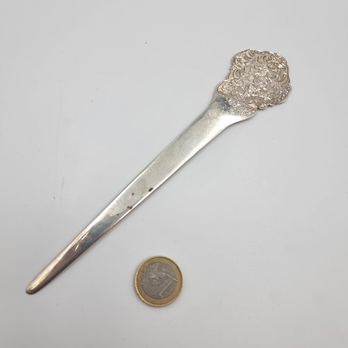 11 - A very attractive Irish silver letter opener/page turner, with a nice foliate relief finial. Hallmar... 