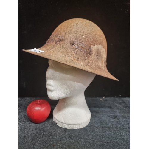 137 - A WWI, antique military Brodie helmet. With original canvas straps on interior and leather banding. ... 