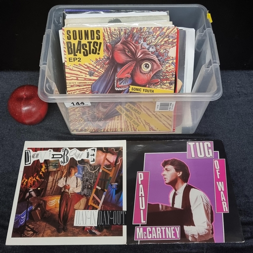 144 - A box containing 26 vinyl singles including examples by Paul McCartney, David Bowie, Sonic Youth, an... 