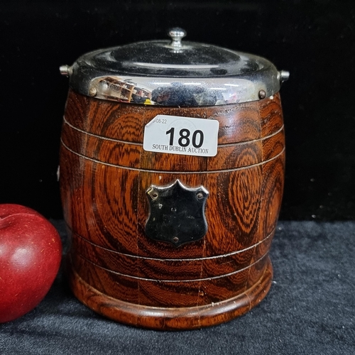 180 - A handsome ice bucket in a form of a copers barrel, with porcelain liner and a beautiful wood exteri... 