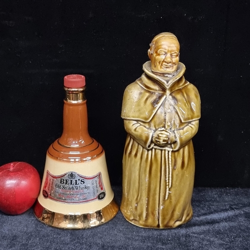 204 - Two items including a Bells Scotch Whiskey decanter and Abbots Choice Scotch Whiskey in a Monks Deca... 