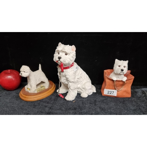 227 - A collection of three Capodimonte dog figurines of West Highland Terriers from the Leonardo Collecti... 