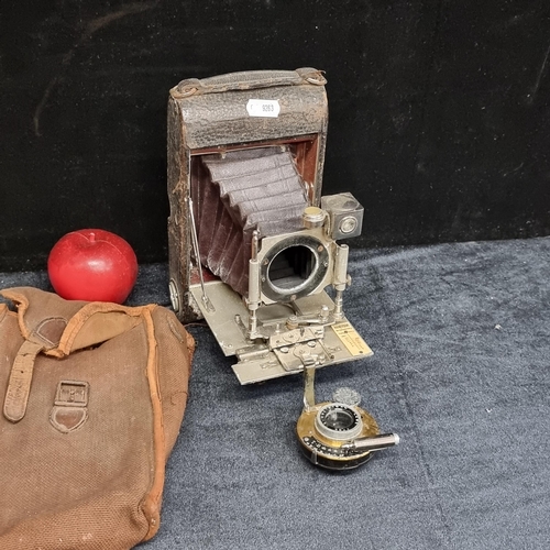 243 - An antique large format Automatic bellows camera with leather casing.