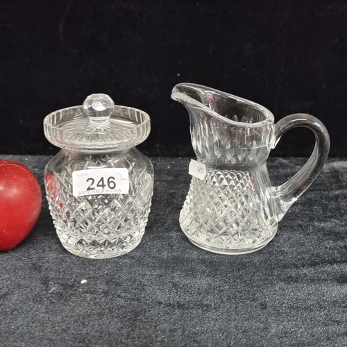 246 - Two Waterford cut crystal items including a cream jug and a preserve jar.