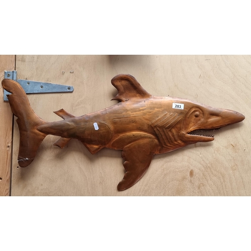 283 - A hammered copper wall hanging in the form of the great white shark, featuring realistic details suc... 