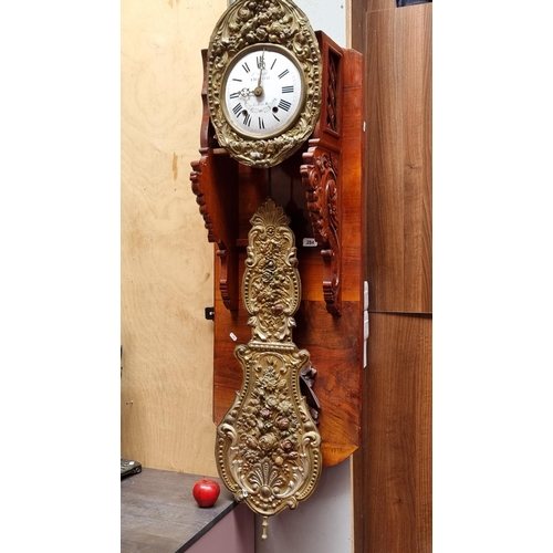 284 - A Fabulous wall clock with white enamel dial on a red Mahogany structure, With carved Eagle in Relie... 