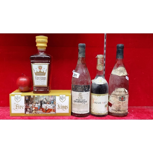 291 - Four sealed vintage bottles of alcohol, including a 650ml bottle of 