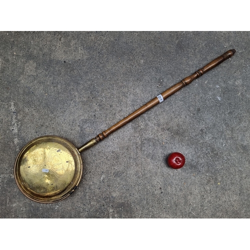 297 - An Edwardian bed warmer with brass pan featuring stag motif, and turned wood handle.