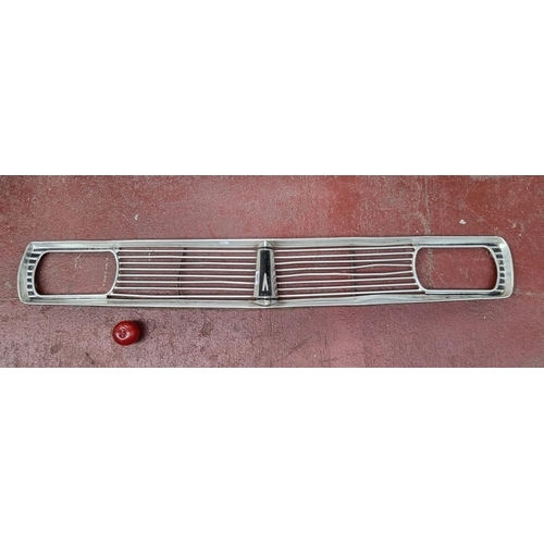 304 - A mid-century aluminium car grill and light casing, featuring the Pontiac Dart symbol to centre. L14... 