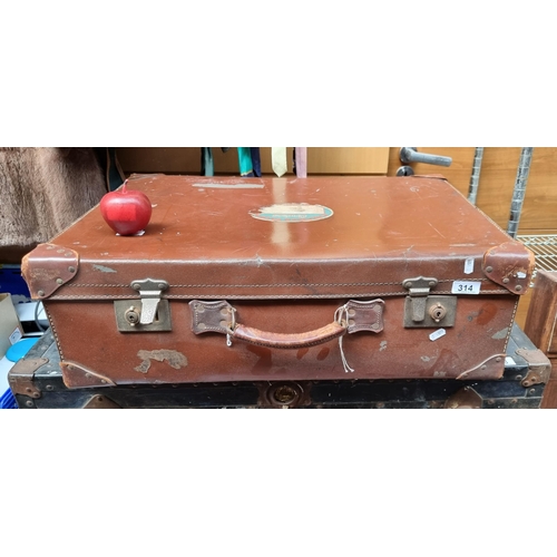 314 - A beautiful Edwardian leather suit case with Canadian Pacific cruises stickers and corner reinforcem... 