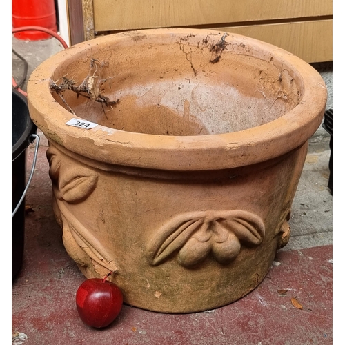 324 - A very large terracotta garden planter H30cm x D46cm.