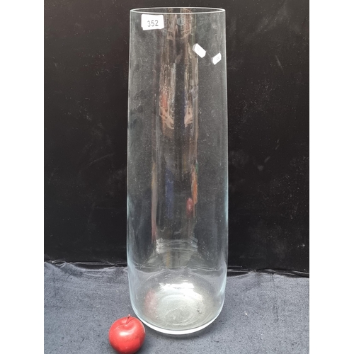 352 - A beautiful hand-blown, floor-standing glass vase, with a stylish, gently tapered neck. Perfect for ... 