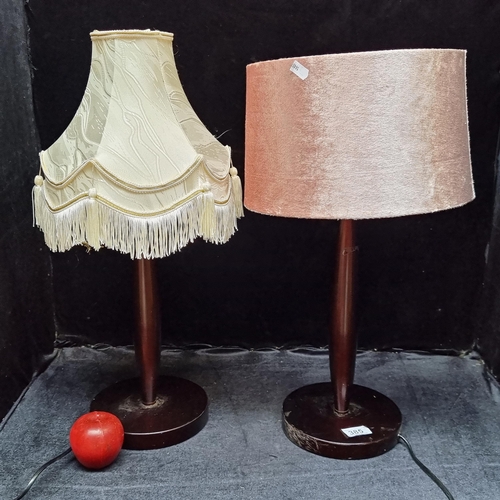 385 - Two heavy metal table lamps with a mahogany brown finish. Both matching bases with stylish shades.