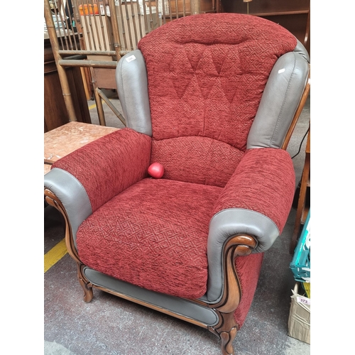 386 - A lovely Italian made fireside chair, with a carved wooden frame and a fantastic grey leather and wo... 