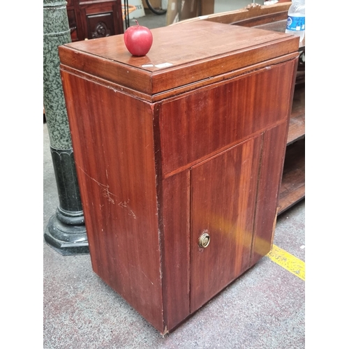 394 - A super retro drinks cabinet with large storage cabinet to base, and mirrored glass storage to top w... 