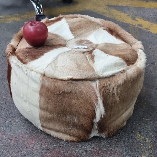 415 - A nice example of a antelope hide footstool in two tone colour.