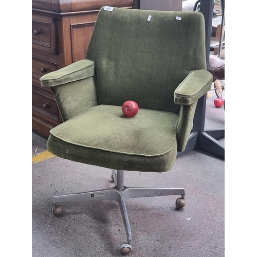 416 - A mid century handsome swivel office chair made by Bryan S Ryan,  upholstered in a forest green velv... 