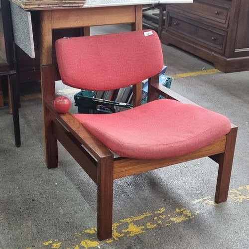 423 - A stunning mid century Danish easy chair with oak wood frame and angled seat upholstered in a red fa... 