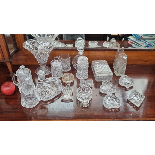 427 - 22 pieces of cut crystal including card suit shaped dishes, thistle shaped dish, vases, cups and con... 