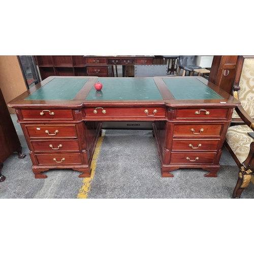 431 - Star Lot : A large partners desk with 12 drawers and two cabinets, columnar edging and a green leath... 