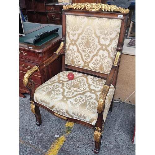 434 - A very large open armed Empire style chair with gilt decoration and damask upholstery. In lovely con... 