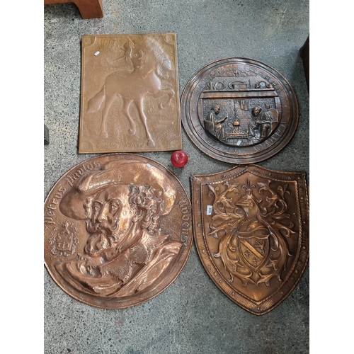 435 - A collection of 4 copper wall chargers including a Knights sheild, a bust of Peter Paul Reubens, a h... 