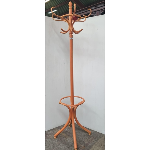 444 - An antique bentwood coat stand which has had the later addition of a burnt orange finish.