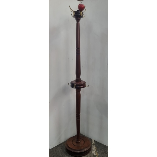 447 - A super turned wood antique coat and hat stand, with a turned baluster column and brass hooks on a c... 