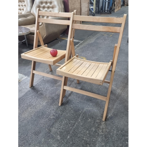 459 - A pair of stylish, folding wooden chairs, with box joints and slated seats.