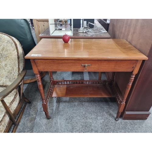 477 - A lovely example of an Edwardian golden mahogany writing bureau on ceramic casters, with finely turn... 