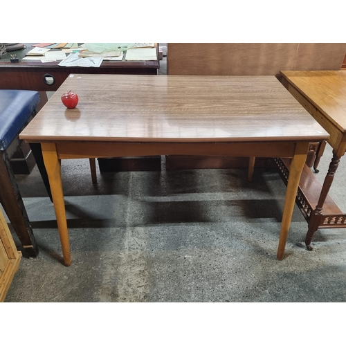 485 - A neatly proportioned mid century dining table, with a high shine finish to top.