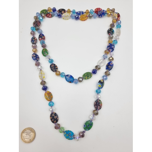 551 - A beautiful and vivid hand painted Murano Glass long necklace. Stunning piece.