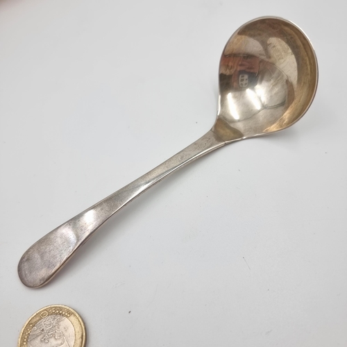 553 - A attractive Irish silver sauce ladle, hallmarked Dublin, 1984 with a makers mark stating 