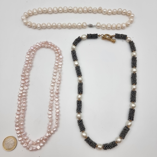 557 - A collection of three good quality natural pearl necklaces. Measuring 42cm, 50cm and 82cm.